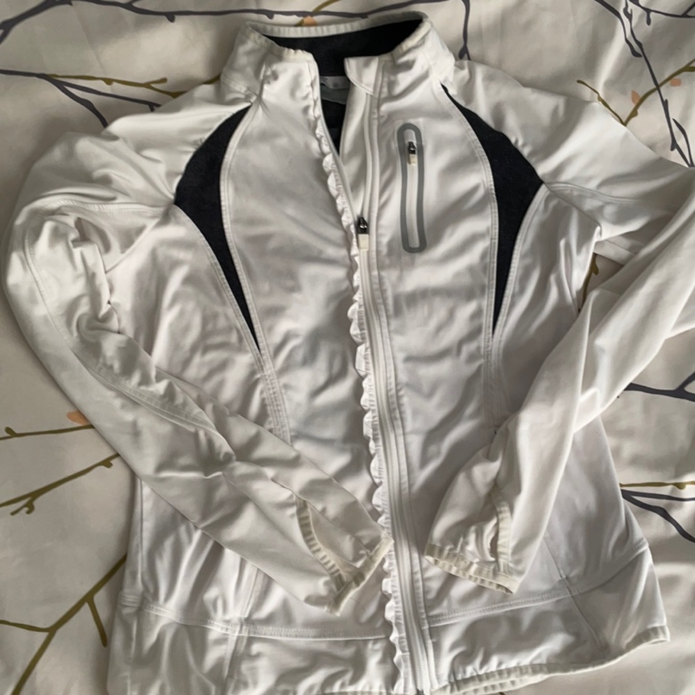 Athleta white zip up jacket with thumb holes.